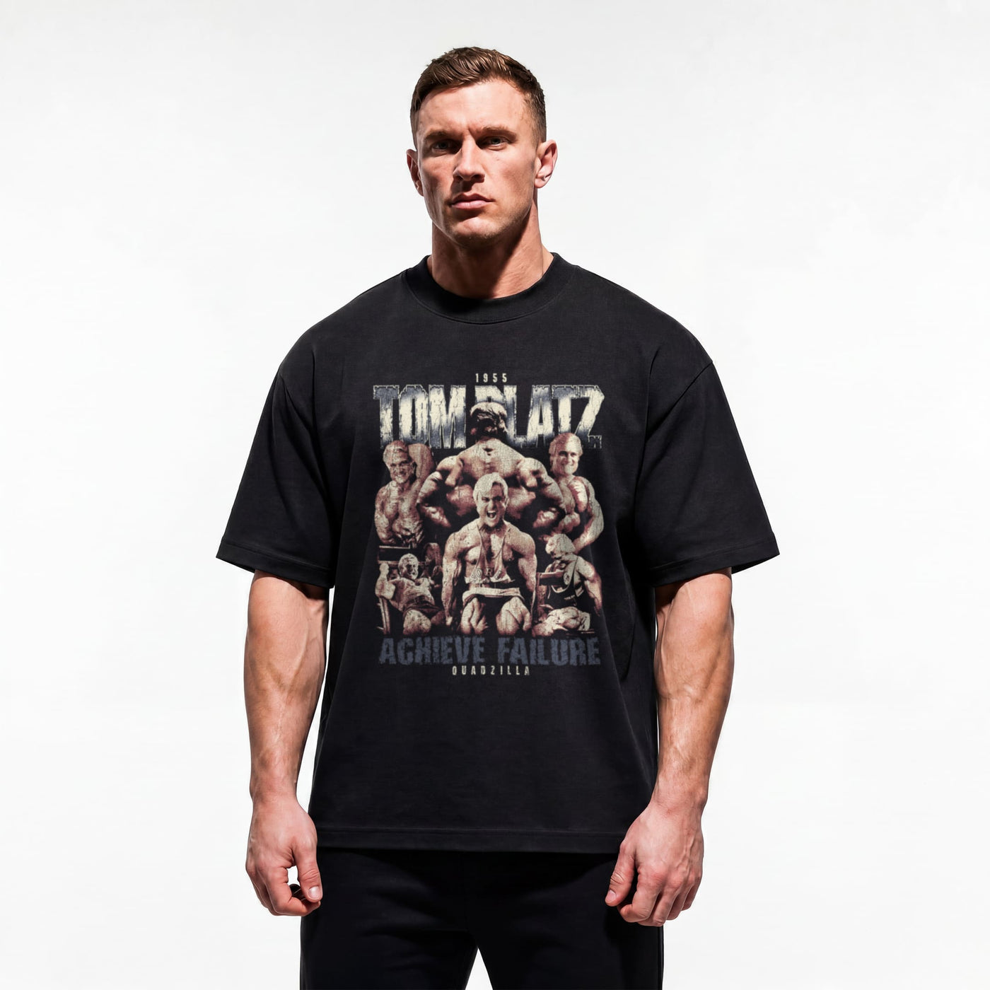 Model wearing Most Natty Achieve Failure Tom Platz bodybuilding oversized t-shirt showing relaxed drop-shoulder fit