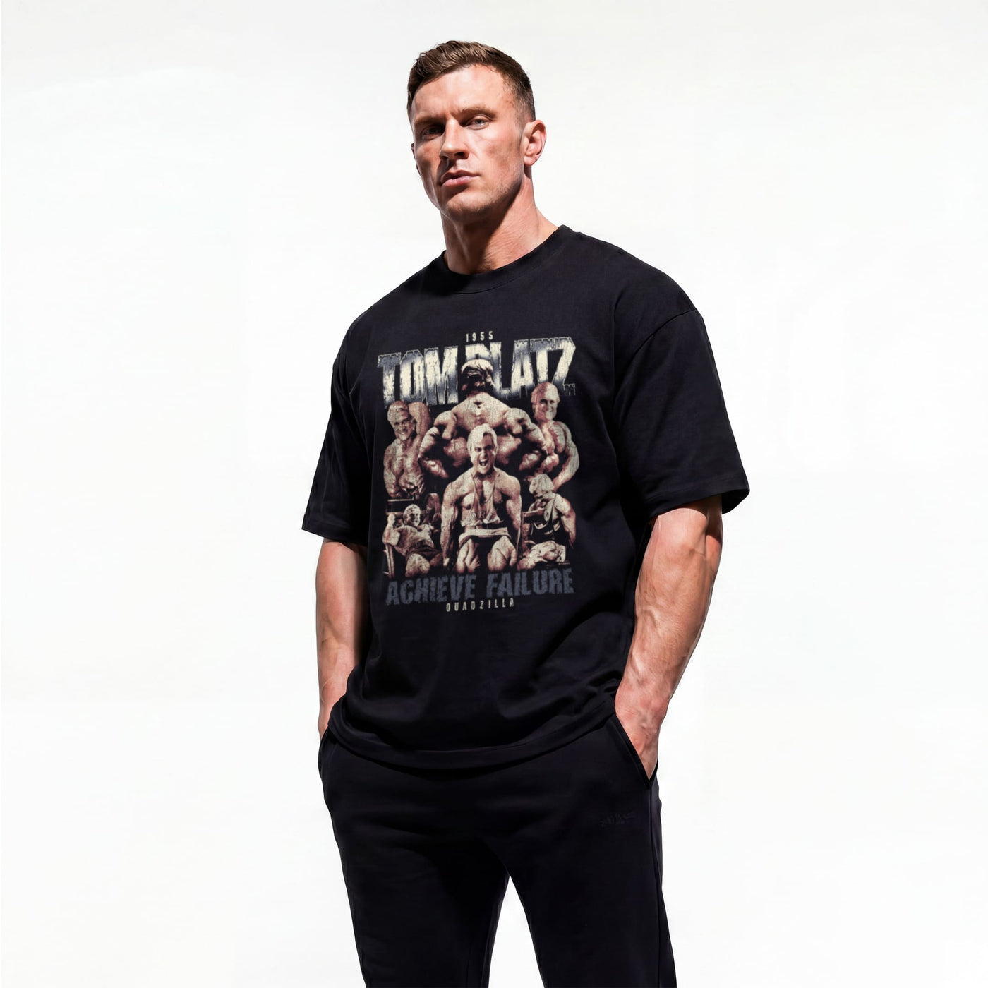 Model wearing Most Natty Achieve Failure Tom Platz bodybuilding oversized t-shirt showing front graphic print