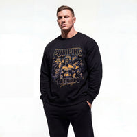 Model wearing Arnold Schwarzenegger Pumping Iron bodybuilding pump cover crewneck showing front graphic print