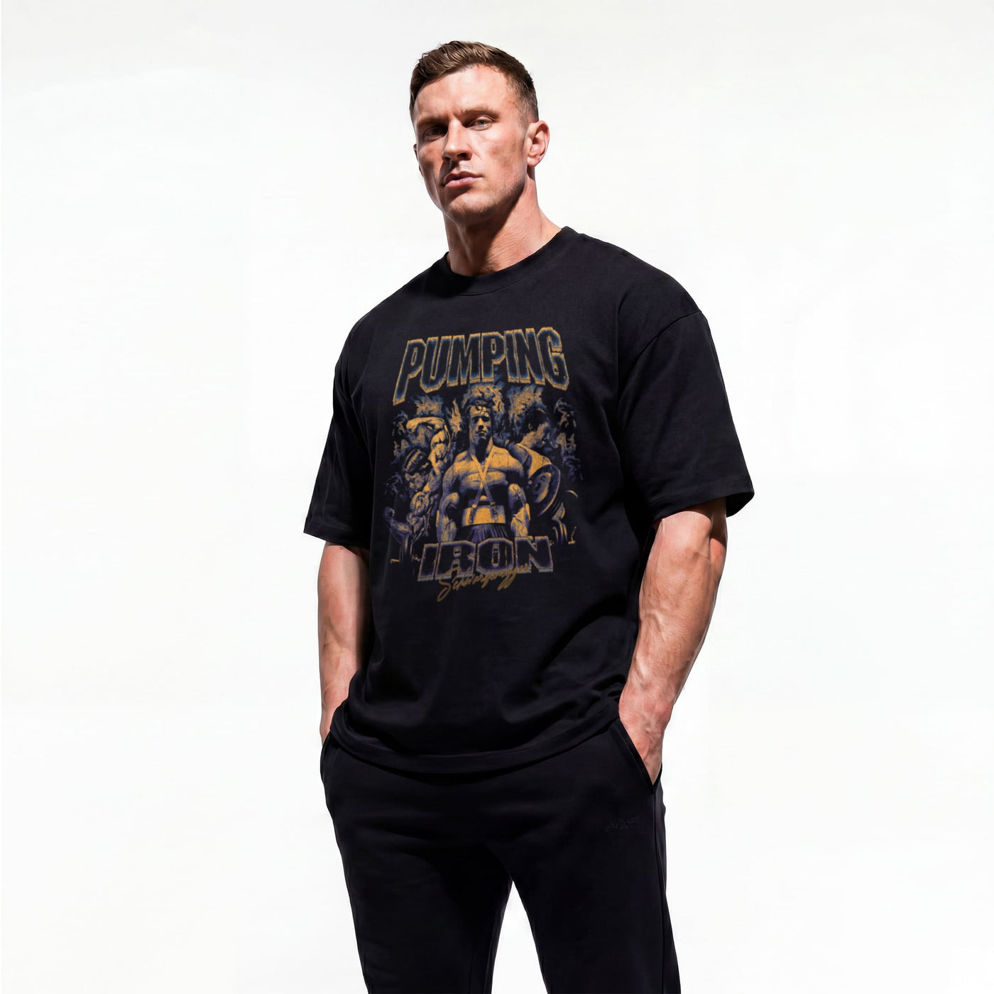Model wearing Arnold Schwarzenegger Pumping Iron bodybuilding oversized t-shirt showing front graphic print