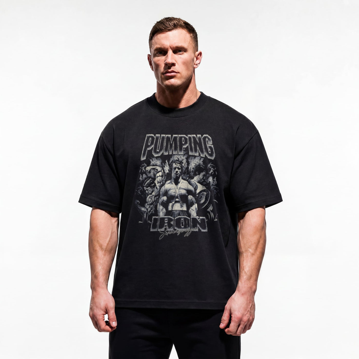 Model wearing Most Natty Pumping Iron bodybuilding oversized t-shirt showing relaxed drop-shoulder fit