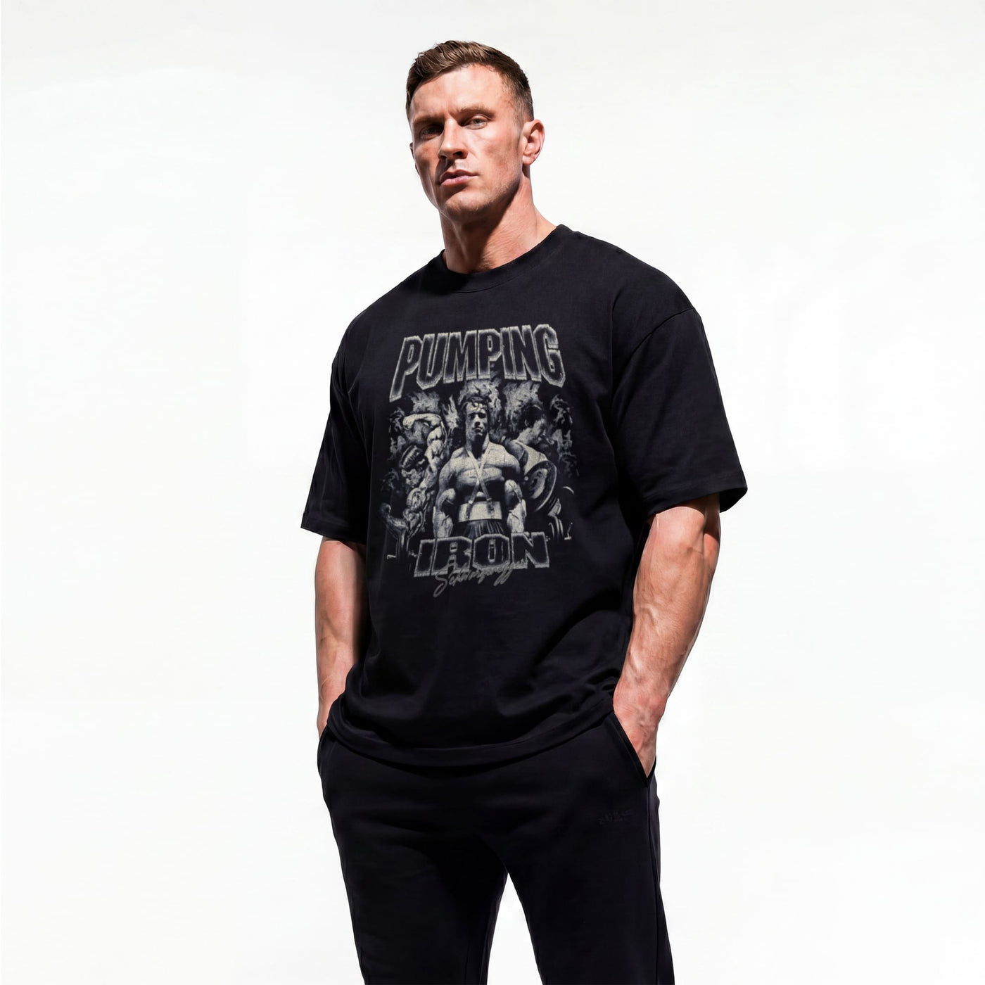 Model wearing Most Natty Pumping Iron bodybuilding oversized t-shirt showing front graphic print