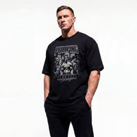Model wearing Most Natty Pumping Iron bodybuilding oversized t-shirt showing front graphic print