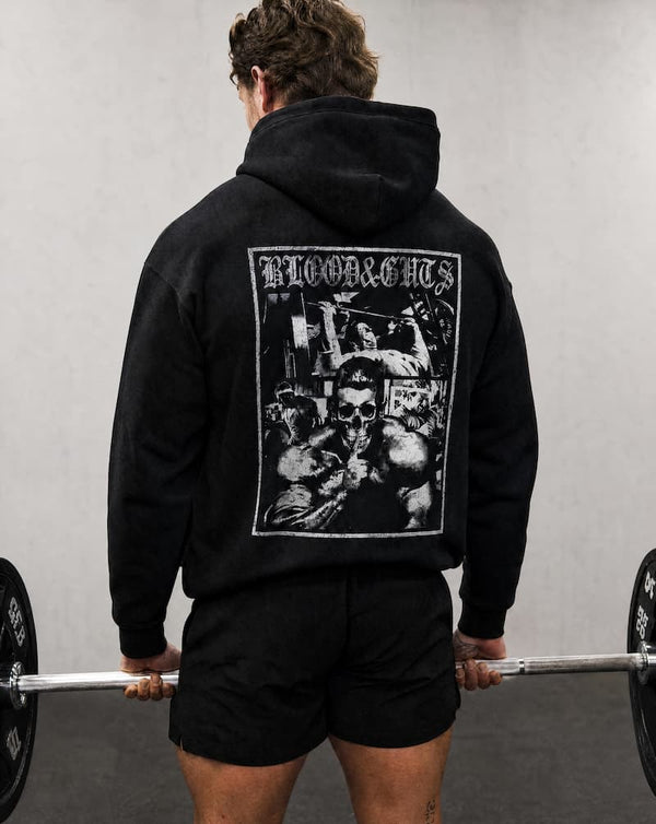 Rear view of Model in gym doing dead lift wearing Blood & Guts Hoodie