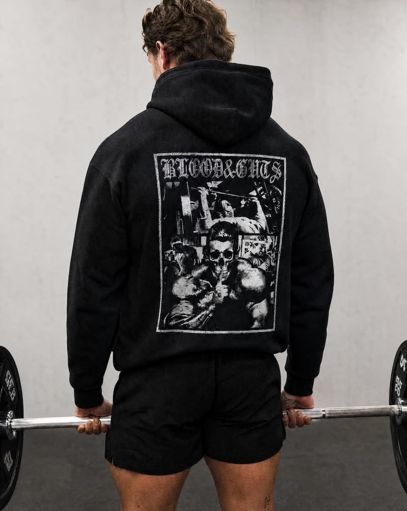 Rear view of Model in gym doing dead lift wearing Blood & Guts Hoodie