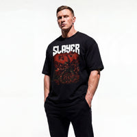 Model wearing Most Natty Slayer bodybuilding oversized t-shirt showing front graphic print