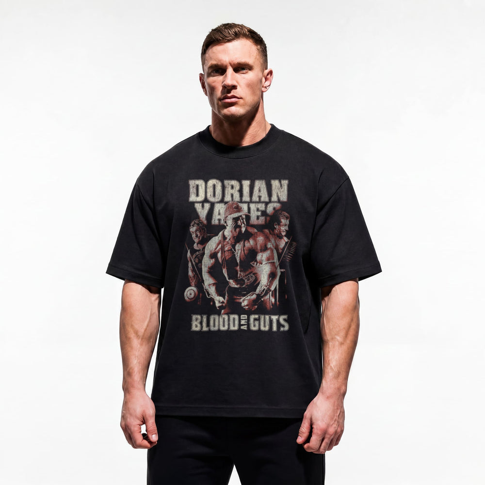 Model wearing Most Natty Blood and Guts bodybuilding oversized t-shirt showing relaxed drop-shoulder fit