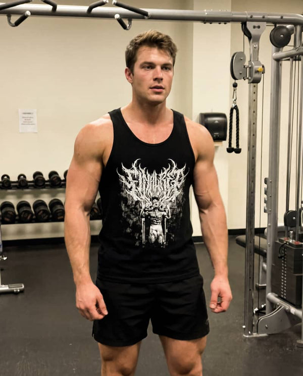 Man in gym posing wearing Final Rep Tank Top