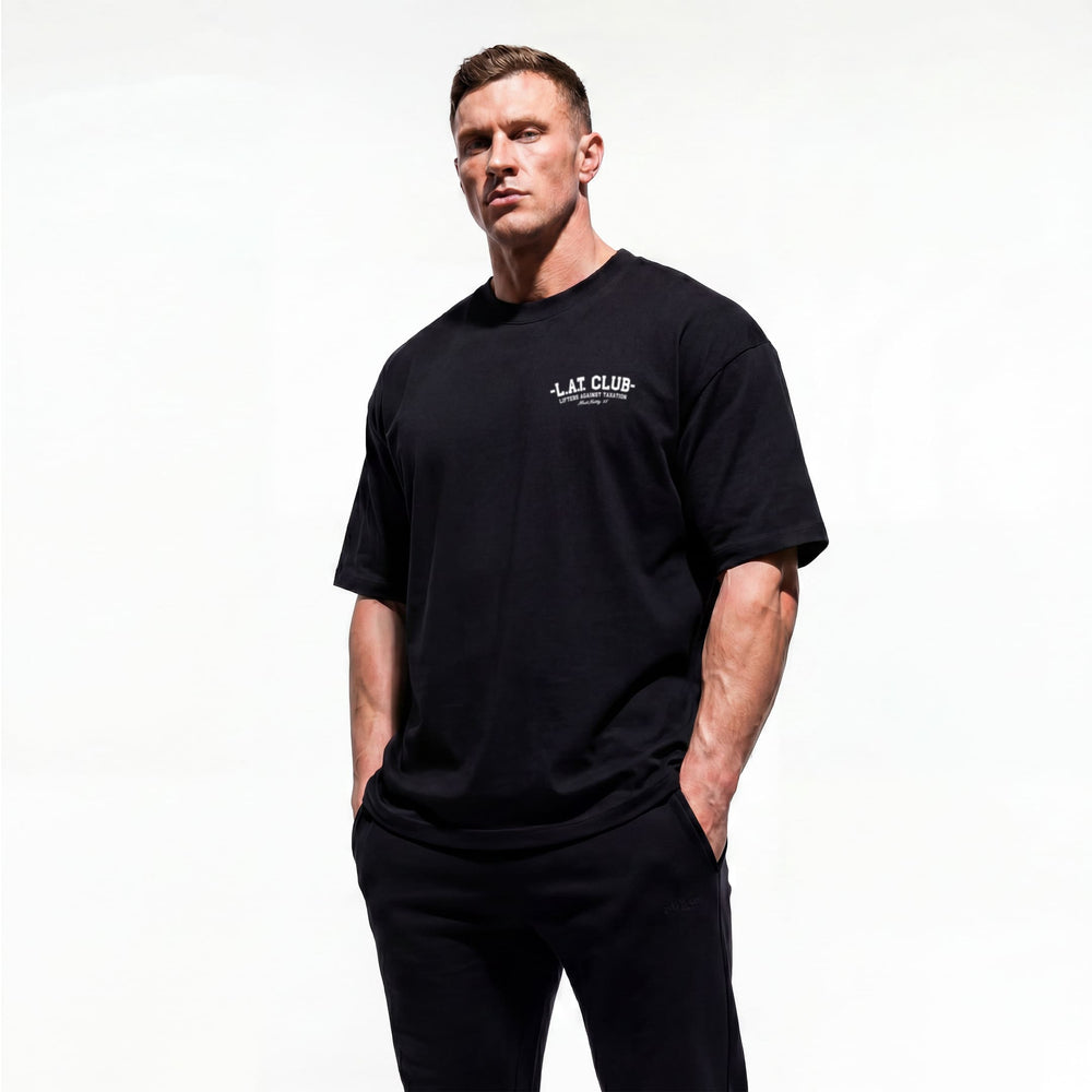 Model wearing Most Natty LAT Club bodybuilding oversized t-shirt showing front graphic print