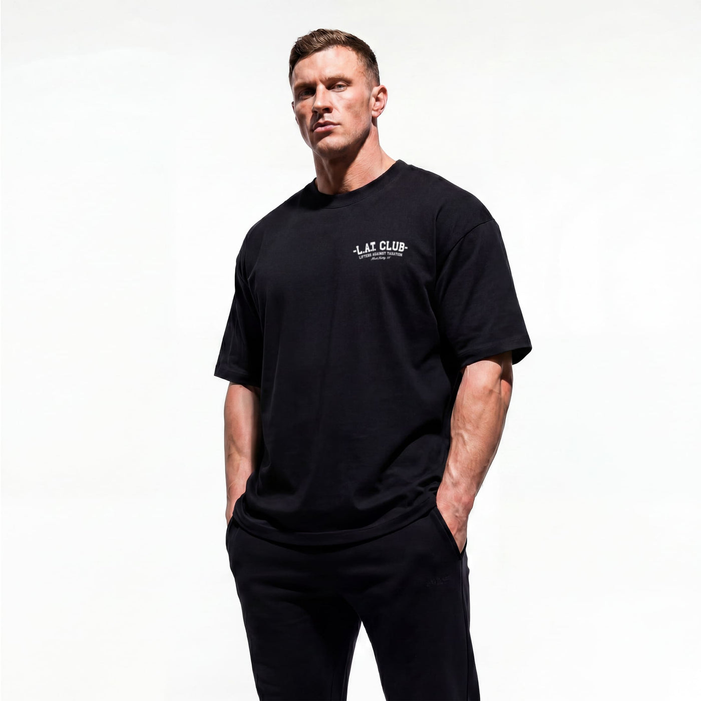 Model wearing Most Natty LAT Club bodybuilding oversized t-shirt showing front graphic print
