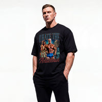 Model wearing Markus Ruhl I Hate the Antichrist bodybuilding oversized t-shirt showing front graphic print
