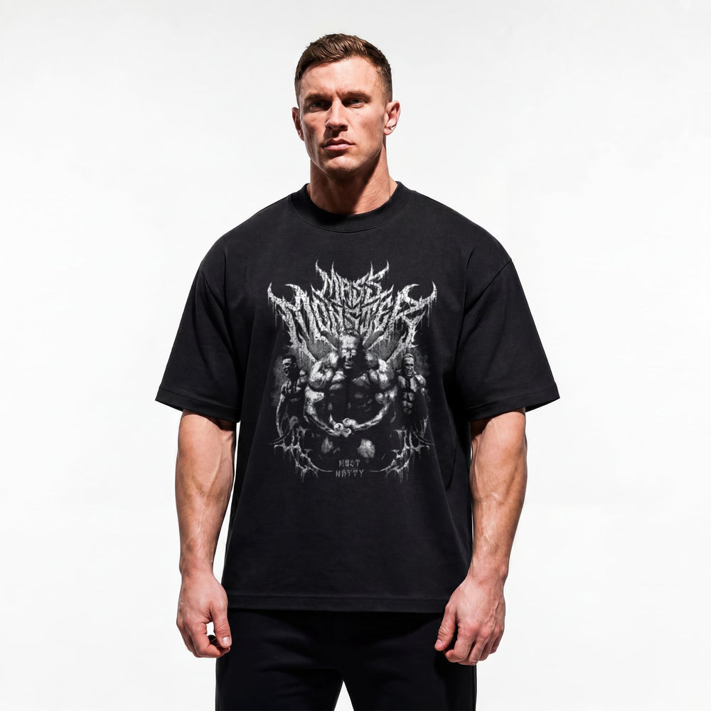 Model wearing Markus Ruhl Mass Monster bodybuilding oversized t-shirt showing relaxed drop-shoulder fit