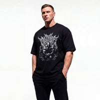 Model wearing Most Natty Mass Monster bodybuilding oversized t-shirt showing front graphic print