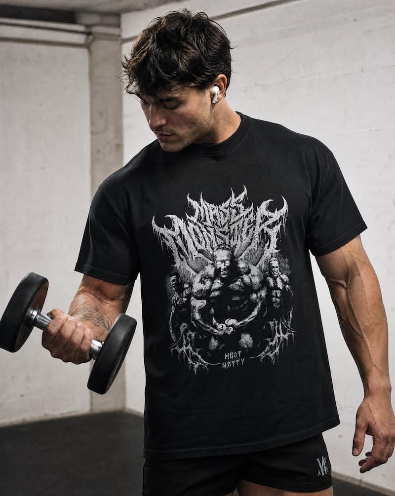 Man doing bicep curls wearing Mass Monster T-shirt