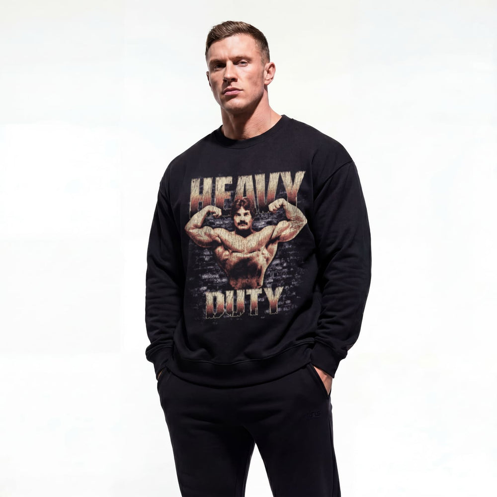 Model wearing Mike Mentzer Heavy Duty bodybuilding pump cover crewneck showing front graphic print