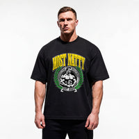 Model wearing Most Natty Most Natty College bodybuilding oversized t-shirt showing relaxed drop-shoulder fit