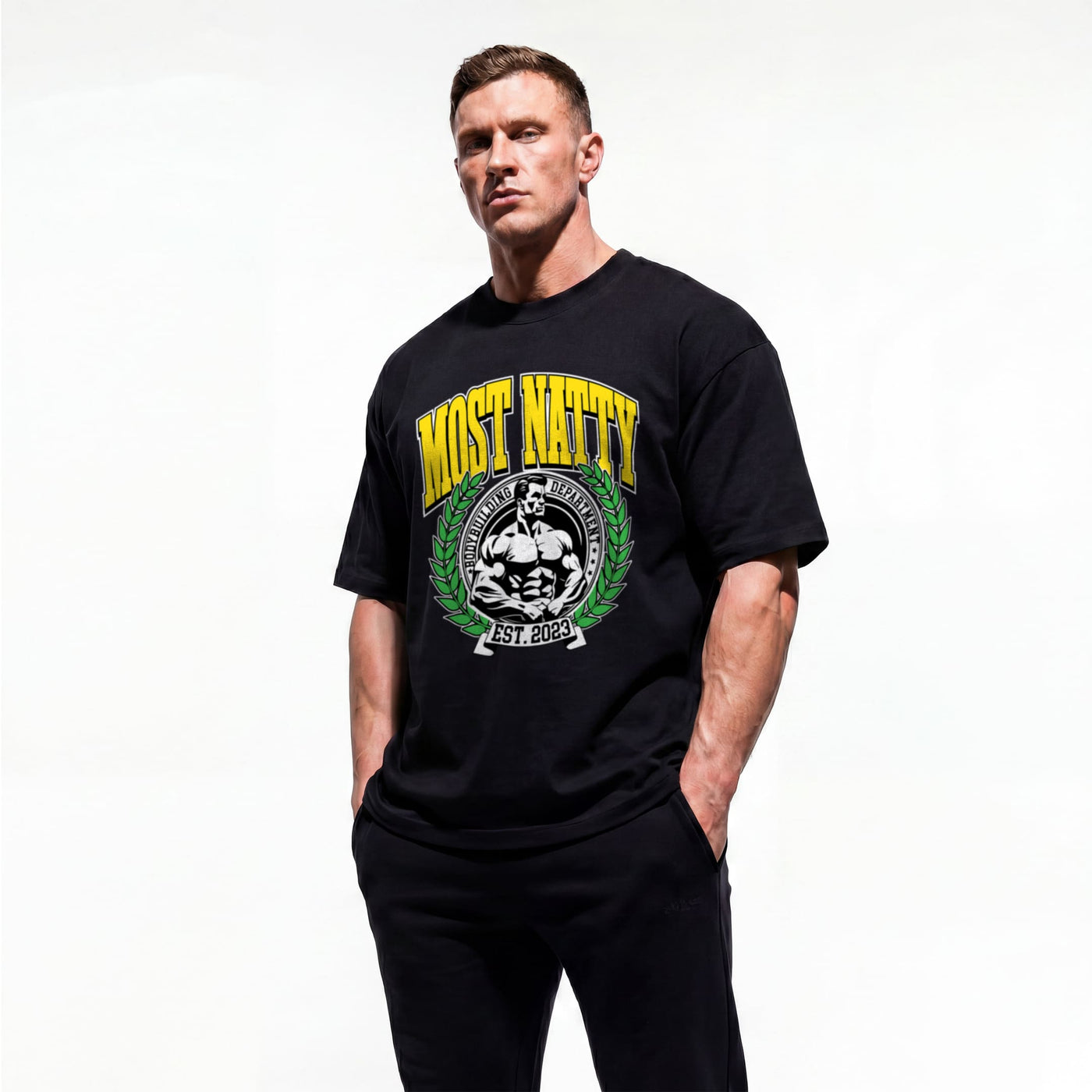 Model wearing Most Natty Most Natty College bodybuilding oversized t-shirt showing front graphic print