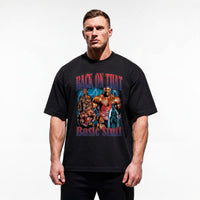 Model wearing Most Natty Back On That Basic Stuff bodybuilding oversized t-shirt featuring Ronnie Coleman and showing relaxed drop-shoulder