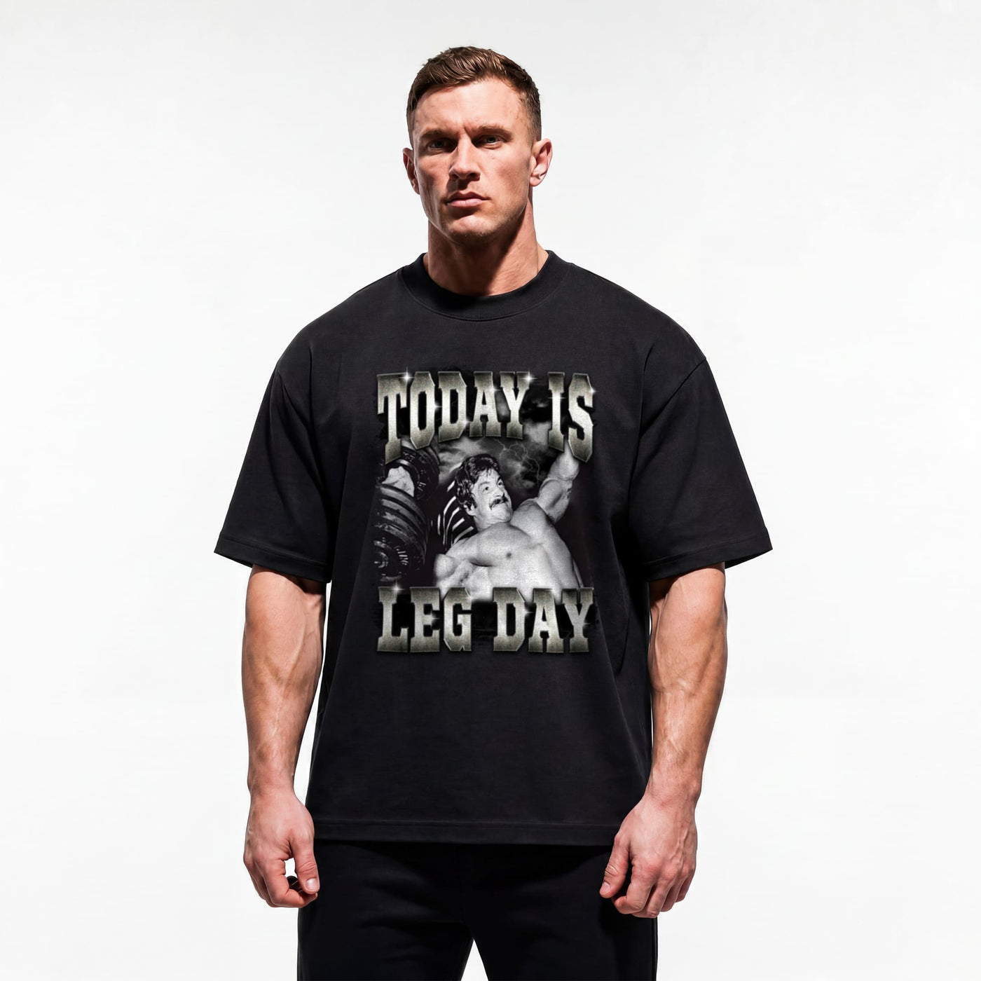 Model wearing Mike Mentzer Today Is Leg Day bodybuilding oversized t-shirt showing relaxed drop-shoulder fit