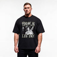 Model wearing Mike Mentzer Today Is Leg Day bodybuilding oversized t-shirt showing relaxed drop-shoulder fit