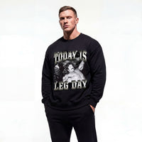 Model wearing Mike Mentzer Today Is Leg Day bodybuilding pump cover crewneck showing front graphic print