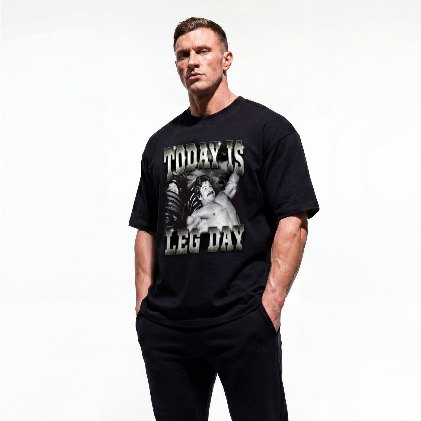 Model wearing Mike Mentzer Today Is Leg Day bodybuilding oversized t-shirt showing front graphic print