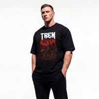 Model wearing Most Natty Tren Slayer bodybuilding oversized t-shirt showing front graphic print