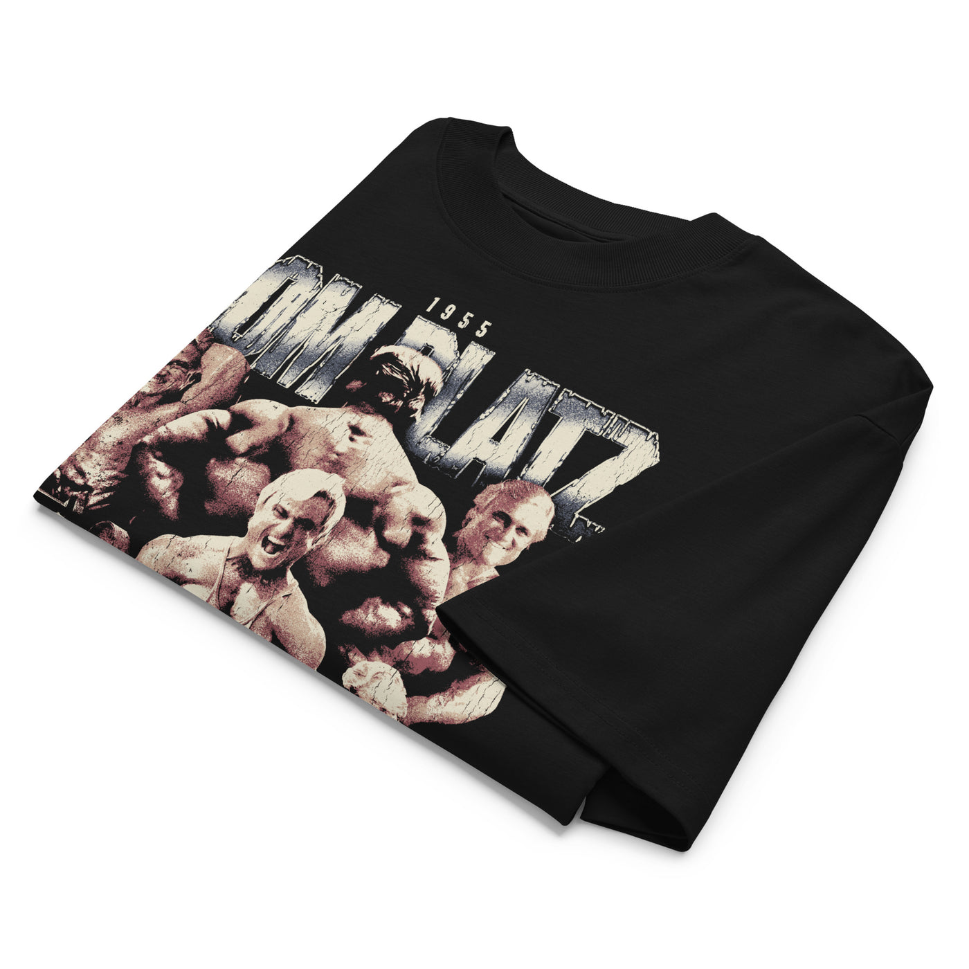 Most Natty Achieve Failure Tom Platz oversized gym t-shirt folded showing black garment fabric and drop-shoulder cut