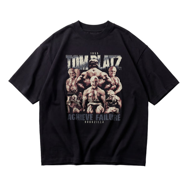 Most Natty Achieve Failure Tom Platz oversized gym t-shirt front flat lay on white background