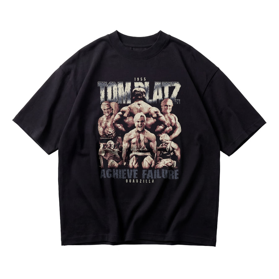 Most Natty Achieve Failure Tom Platz oversized gym t-shirt front flat lay on white background