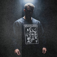 Model wearing Dorian Yates Blood and Guts bodybuilding pump cover crewneck showing relaxed oversized fit in moody setting