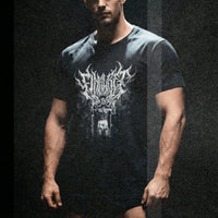 Model wearing Most Natty Final Rep bodybuilding t-shirt showing relaxed classic fit in dark setting