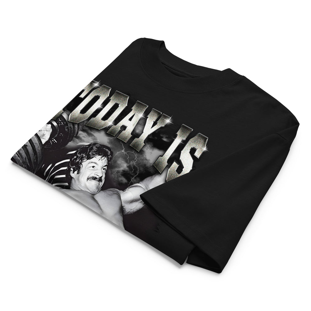 Mike Mentzer Today Is Leg Day oversized gym t-shirt folded showing black garment fabric and drop-shoulder cut