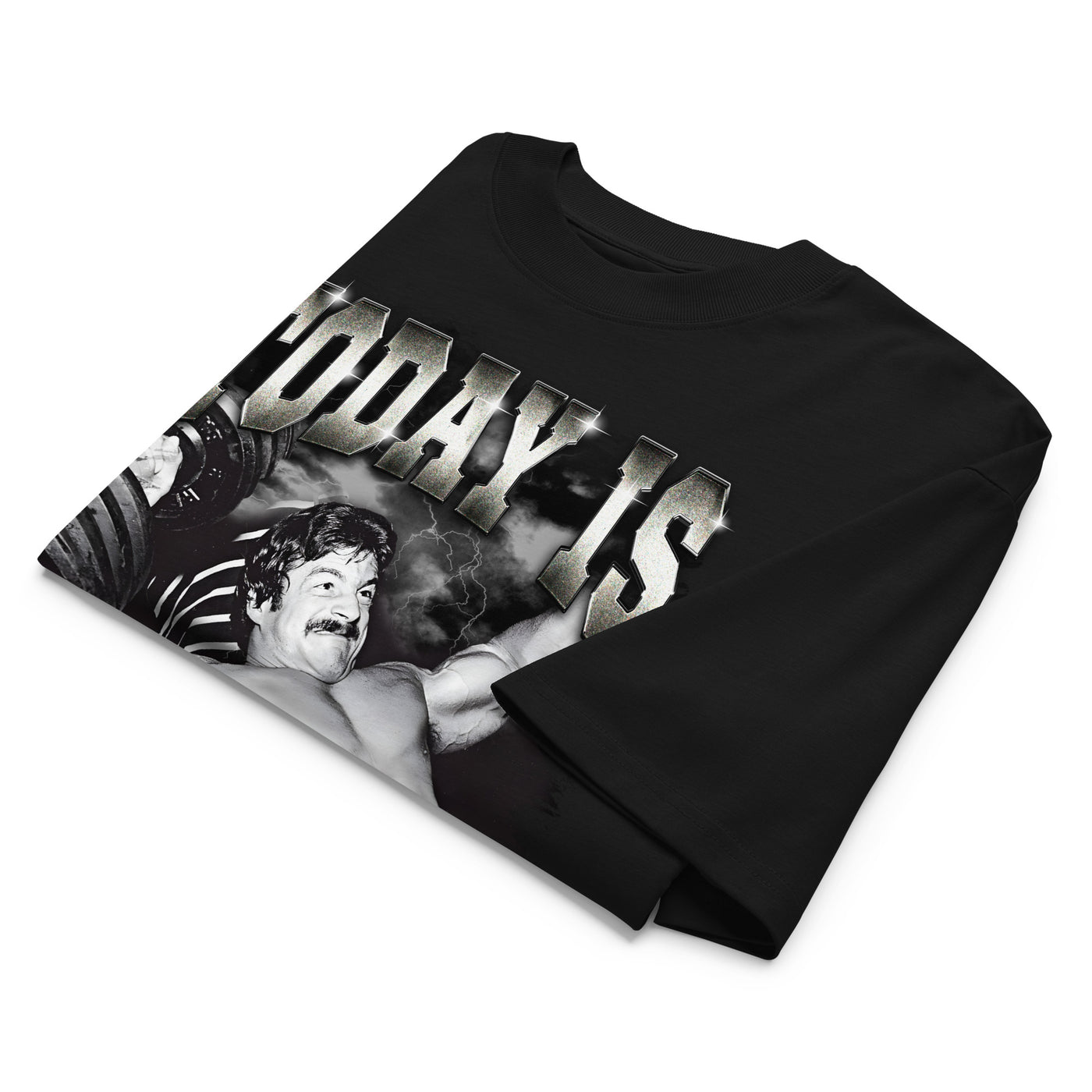 Mike Mentzer Today Is Leg Day oversized gym t-shirt folded showing black garment fabric and drop-shoulder cut